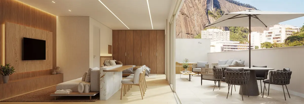 Salón de una unidad de Be in Rio abierto al balcón, con vista a los cerros de Copacabana