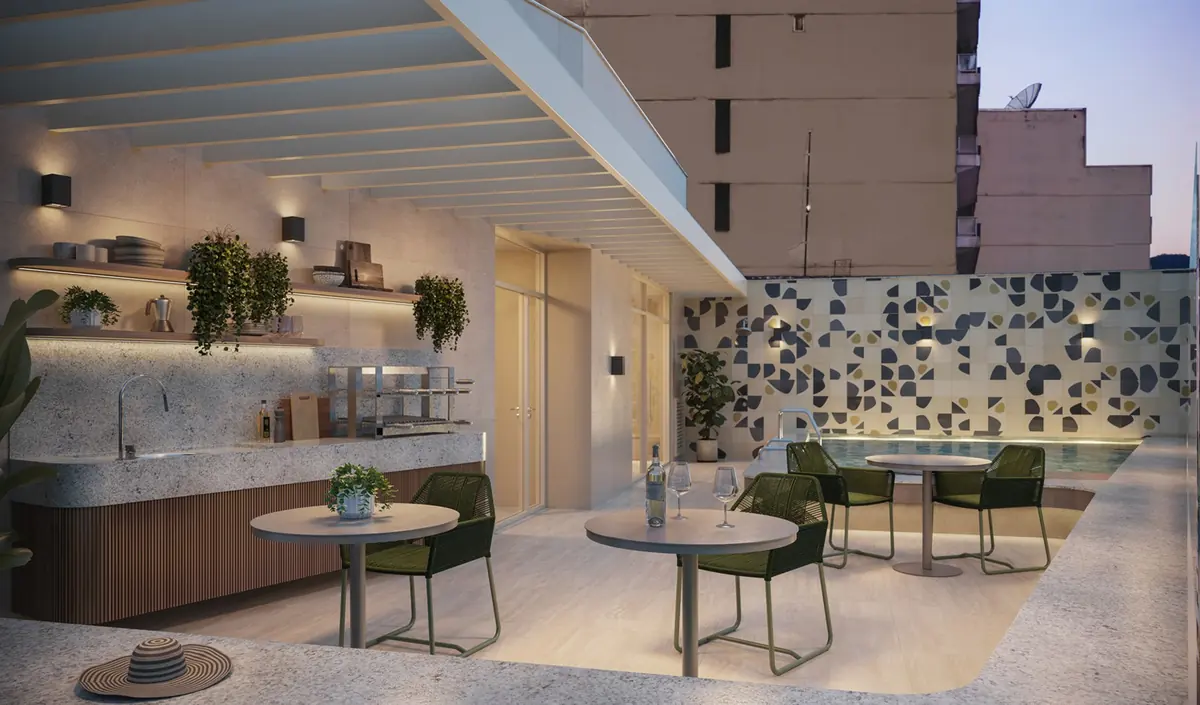 Espacio gourmet de la terraza de Be in Rio, con barra, mesas y jardín vertical