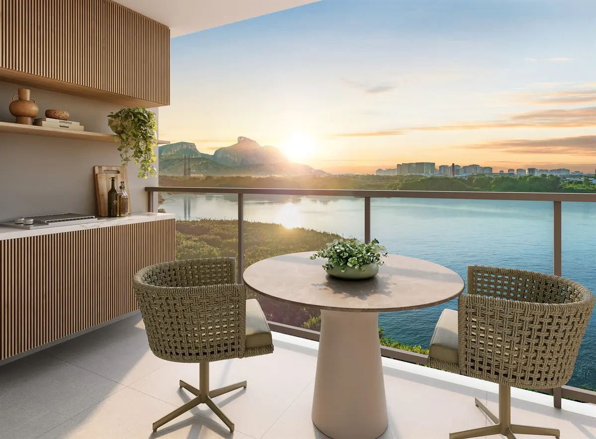 Apartment balcony at Breeze Inspire Residence, with a table for two and an open view of the lagoon