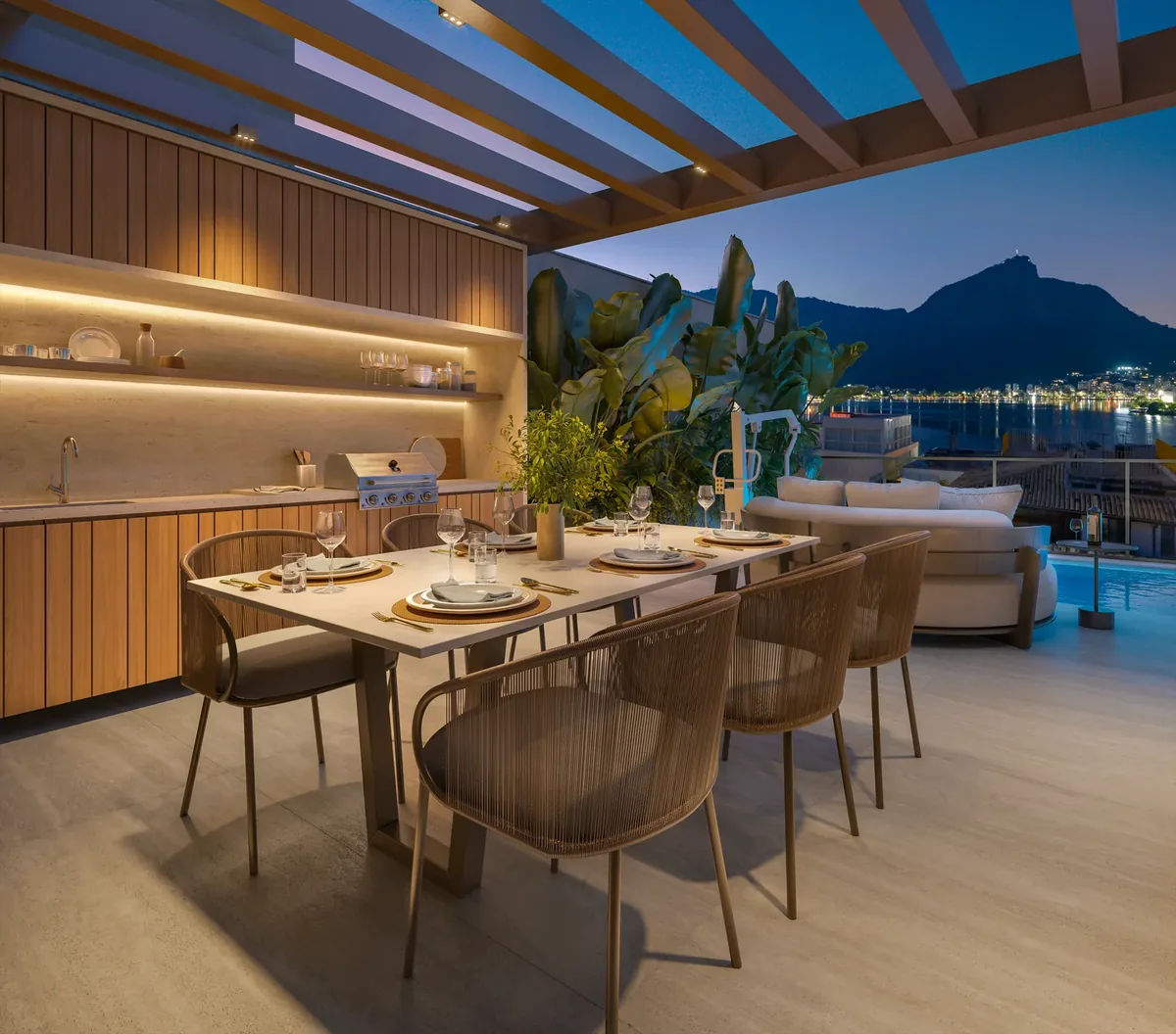 Espaço gourmet do rooftop, com bancada e área de churrasco