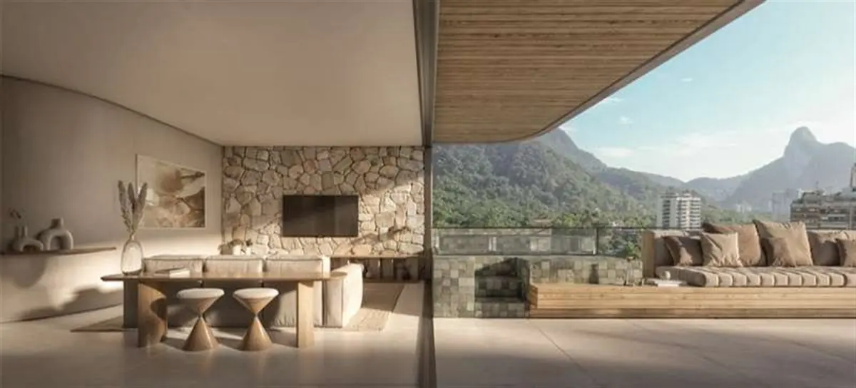 Varanda gourmet do Vista Joá com churrasqueira e mesa de jantar, com a Pedra da Gávea emoldurada pela esquadria