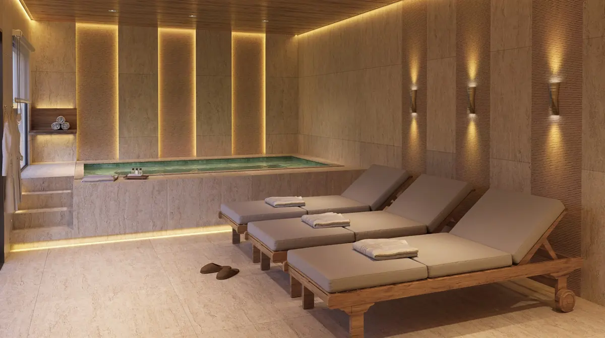 Spa do Vitale Tide, com macas de massagem e revestimento em madeira